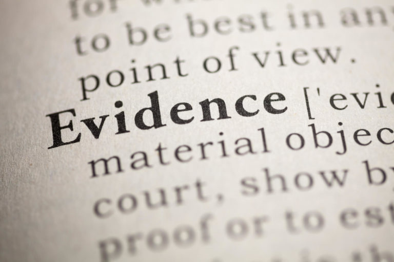 The word and definition of ‘evidence’ in a dictionary.